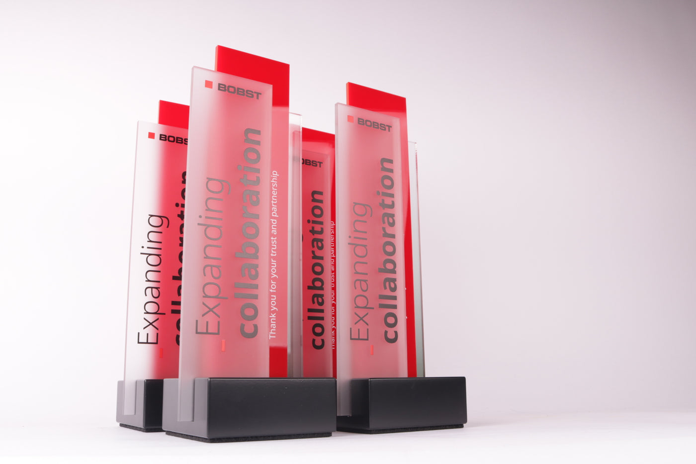 black base with a glass trophy for bobst
