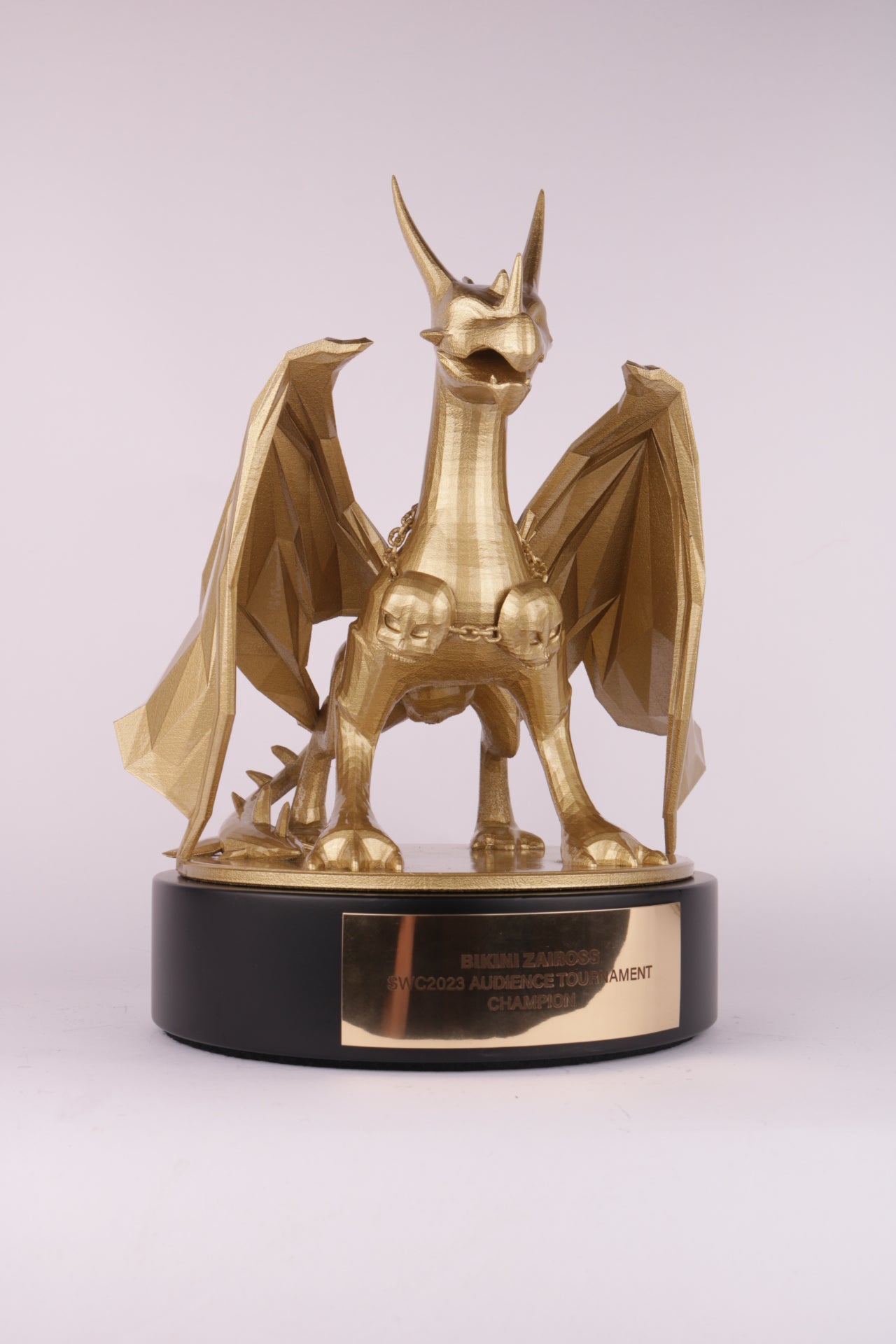 black based trophy with a golden dragon