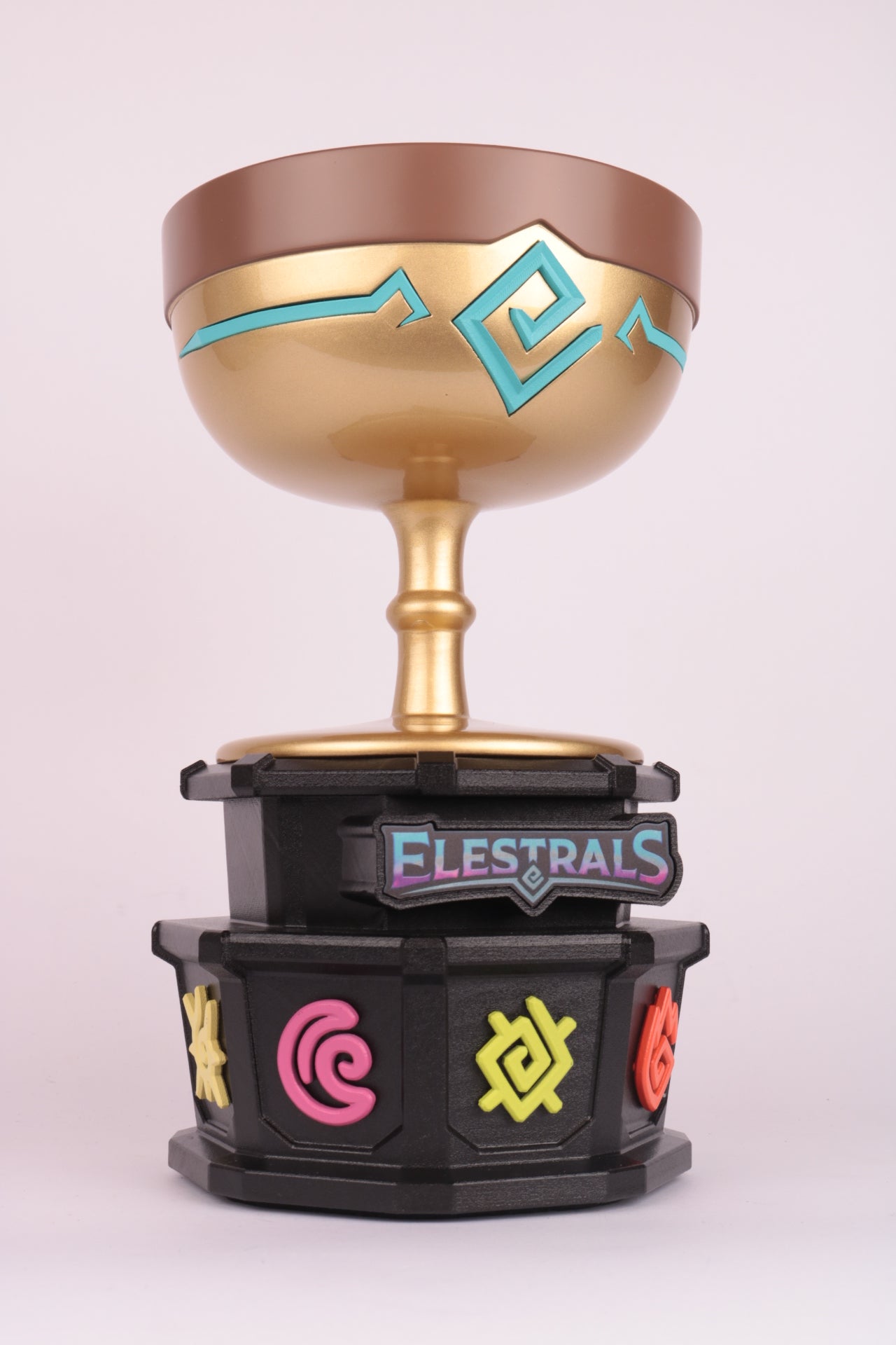 black based trophy with a gold trophy