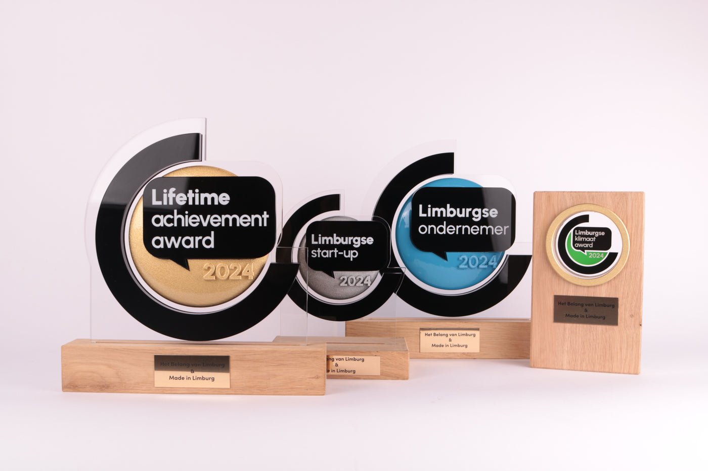 wooden trophy base with an acrylic design on top for het belang van limburg