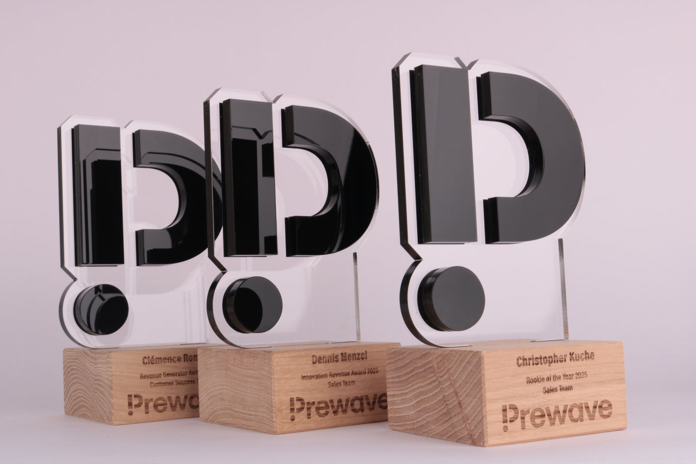 wooden trophy stand with an acrylic design of the logo of prewave