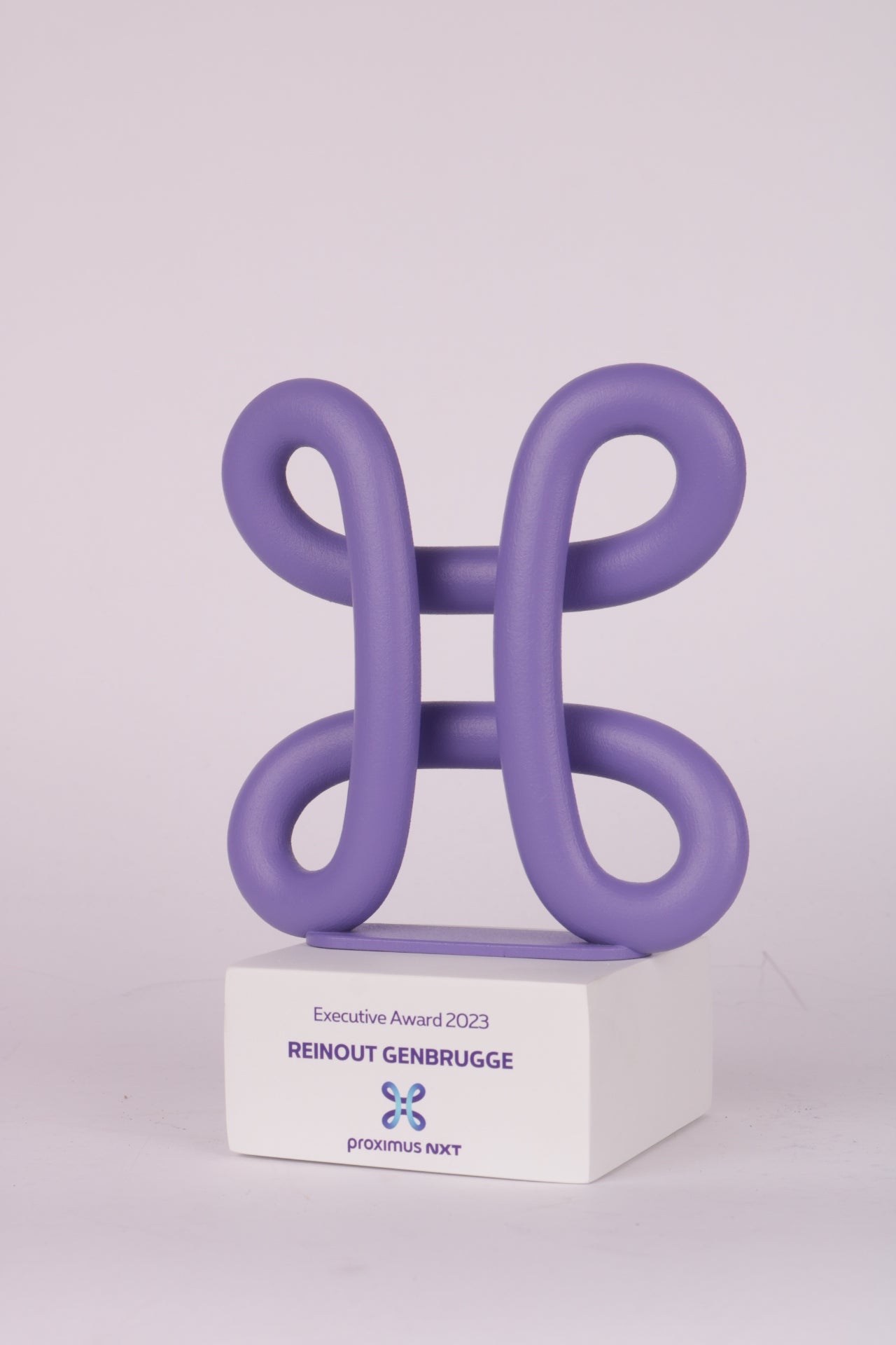 white trophy stand with the 3d printed logo from proximus